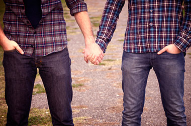 Two men holding hands